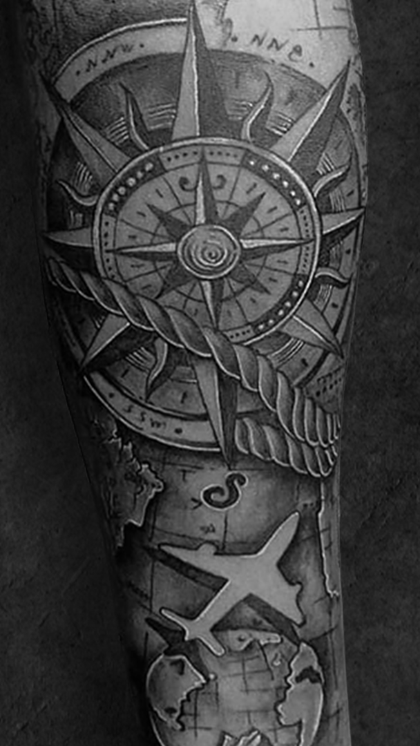 Compass tattoo art in bengal ink tattoo studio